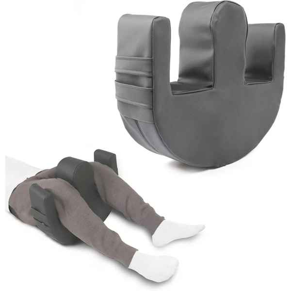 Vändkudde. a black pillow with a black object on it