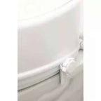Toalettförhöjare med lock 15 cm a close up of a toilet