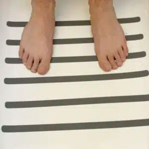 a person's feet on a white surface
