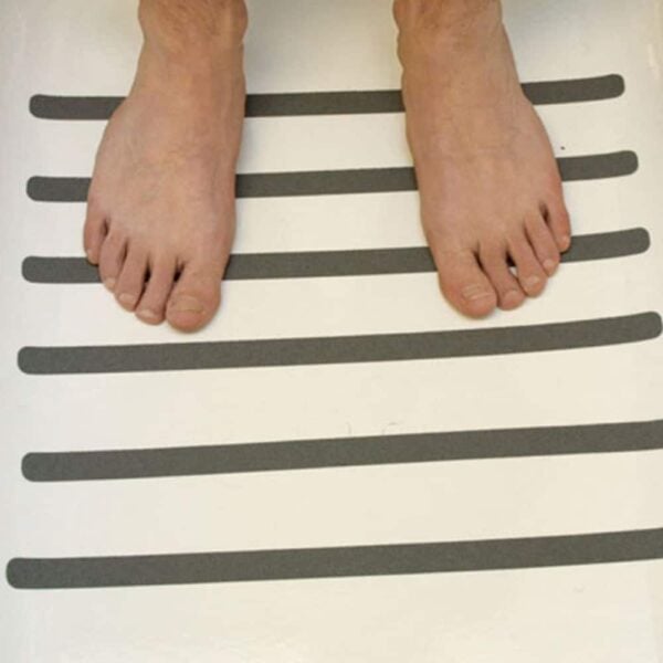 a person's feet on a white surface