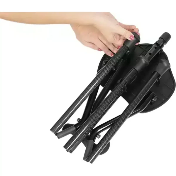Folded cane with carbon fiber seat held in hand for transport