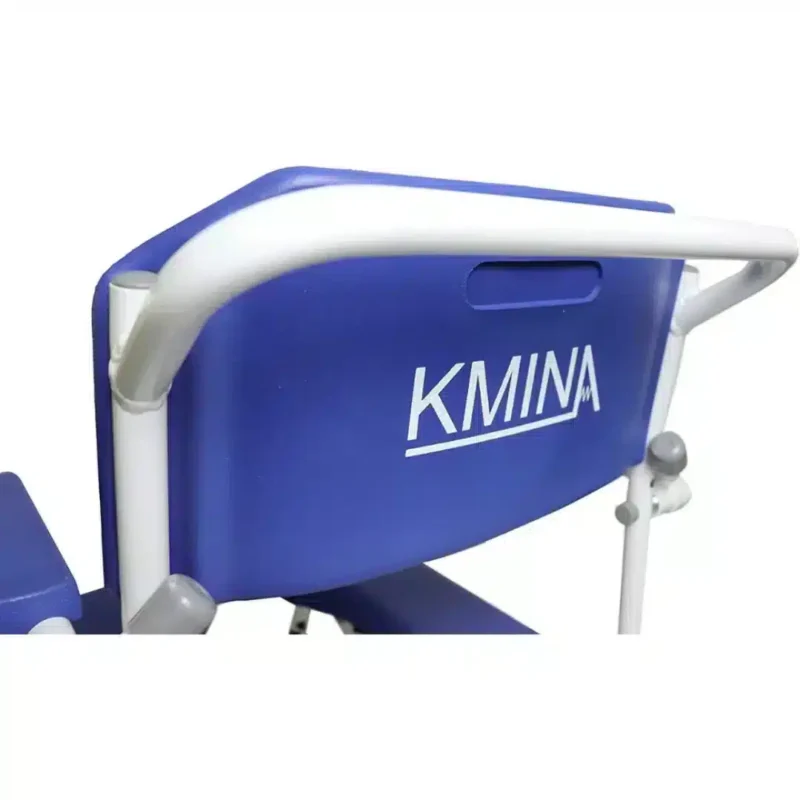 Ergonomiskt ryggstöd med grepp Närbild på ryggstödet med blå vaddering och integrerat handtag