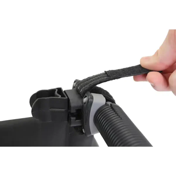 a hand holding a black strap