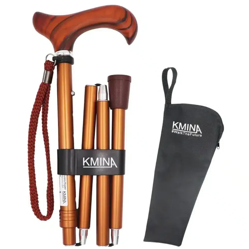 Hopfällbar käpp i brons med trähandtag – gånghjälpmedel Hopfällbar käpp i brons med trähandtag, röd handledsrem och tillhörande svart förvaringspåse.