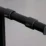 a black object with a round metal handle