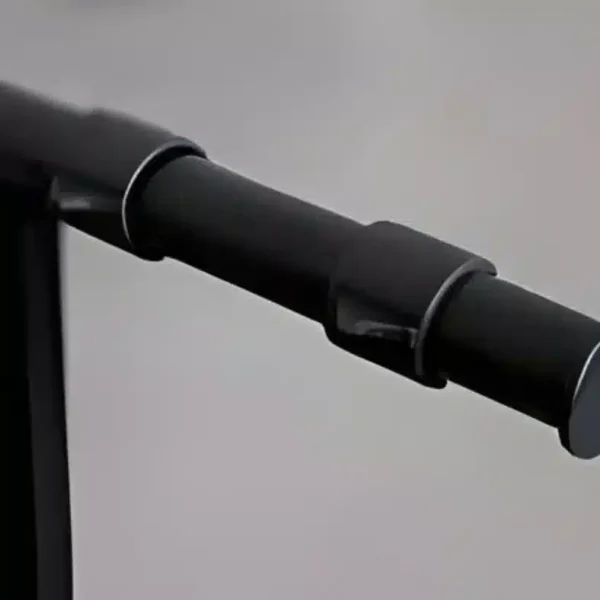 a black object with a round metal handle