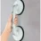 a hand holding a suction cup