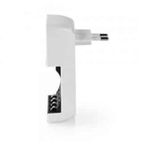 Side view of white battery charger plugged into wall outlet, showing battery compartment.