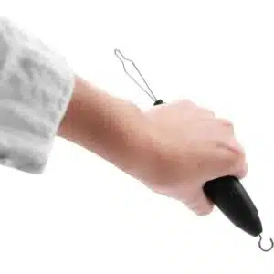 a hand holding a black device