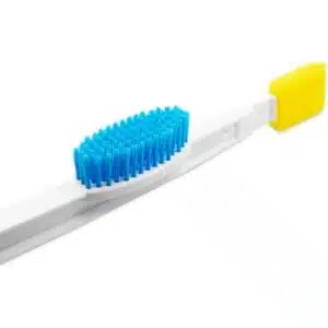 a toothbrush with a yellow and blue bristles
