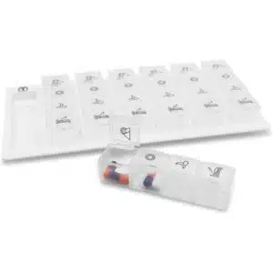 a plastic pill organizer with different pills in it