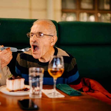 blob-2-24.jpg a man eating a piece of cake