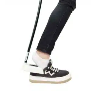 a person's leg with a golf club in it