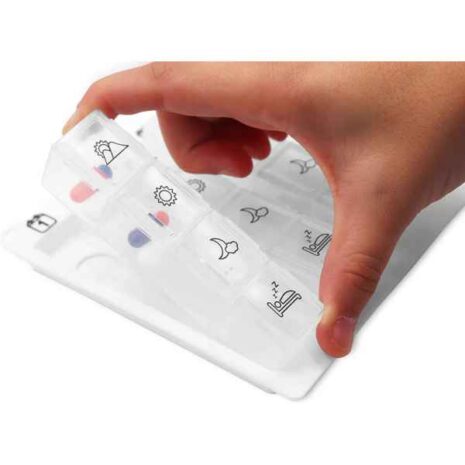 blob-5-64.jpg a hand holding a pill box