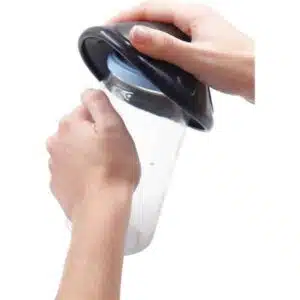 a person holding a jar
