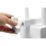a hand holding a white knob