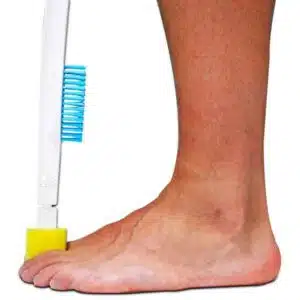 a foot with a toothbrush on it