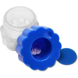 a blue container with a blue lid and a white pill in it