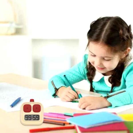 blob-18-1.jpg Digital Timer med LCD a girl sitting at a table writing on paper