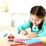 Digital Timer med LCD a girl sitting at a table writing on paper