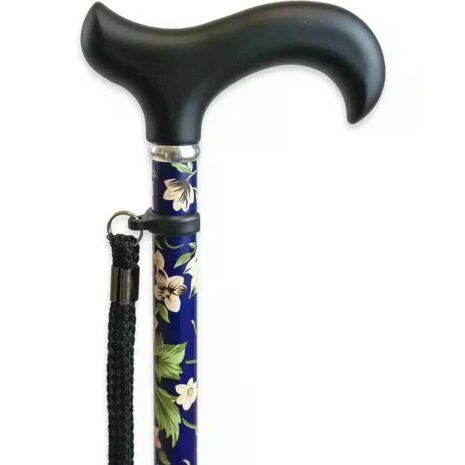 Detaljer – Handtag och handledsrem Hopfällbar käpp med blommönster Närbild på svart handtag och handledsrem till blommig promenadkäpp