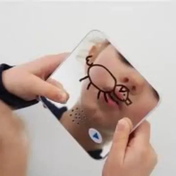a person holding a mirror with a drawing on their face