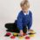 a young boy playing with colorful circles