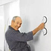 Bathroom handle. a man in a bathrobe smiling