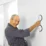 Badrumshandtag. a man in a bathrobe smiling