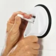 a person opening a suction cup