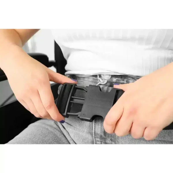 Person fastening seat belt on wheelchair