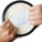 Skydd för gipsad underarm hands pulling a white cloth out of a circular object