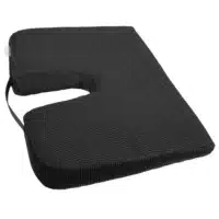 Seat cushion with U-shaped cutout for coccyx relief at an oblique angle