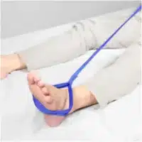 Leg lift strap placed around foot
